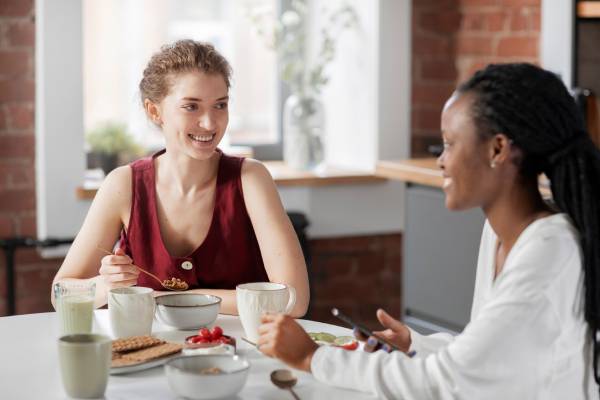 A support worker helping a senior in Melbourne aged care facility.