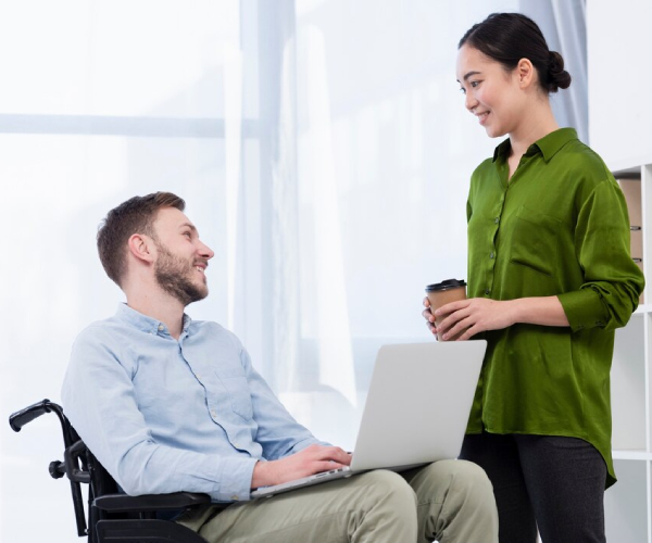 A Dignity Support worker empowering a client to achieve their personal goals.