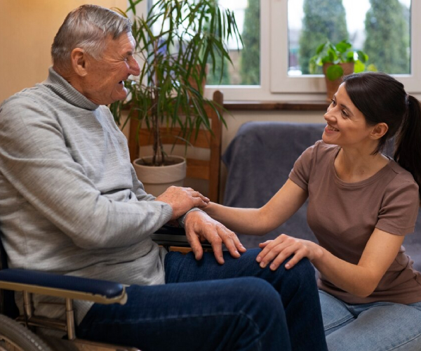 A support worker having a respectful conversation with an NDIS participant in Melbourne