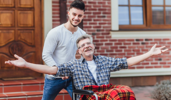 An old men with a disability enjoying outing with their respite worker.